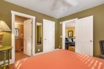 Main level primary bedroom with an ensuite bathroom